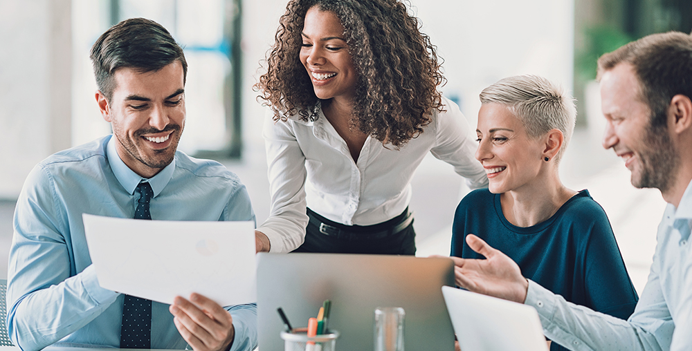 a group of female and male business employees having a meeting