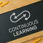 blackboard with words continuous learning written on it