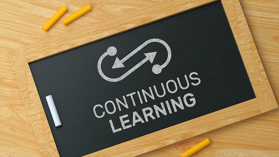 blackboard with words continuous learning written on it