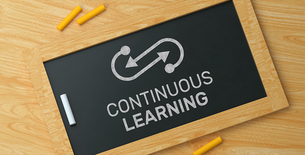 blackboard with words continuous learning written on it