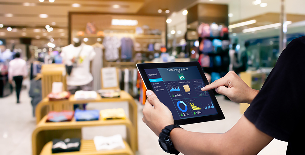 retail worker using tablet to look at data