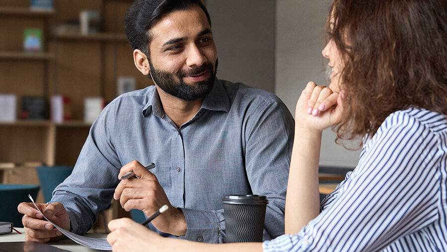 two young professionals having a conversation