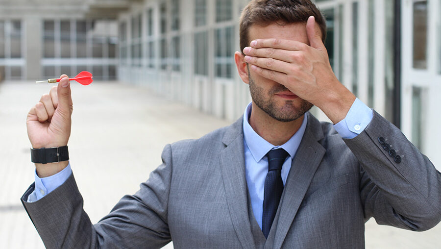 Man covering his eyes
