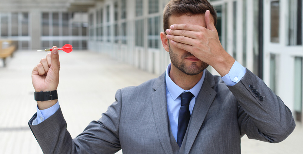 Man covering his eyes