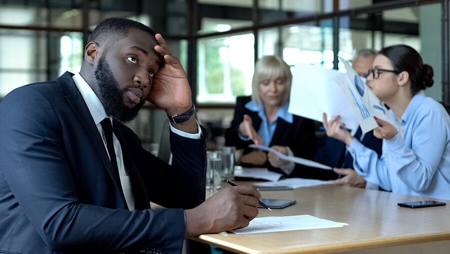 man in business meeting looking confused