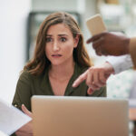 young business woman looking overwhelmed