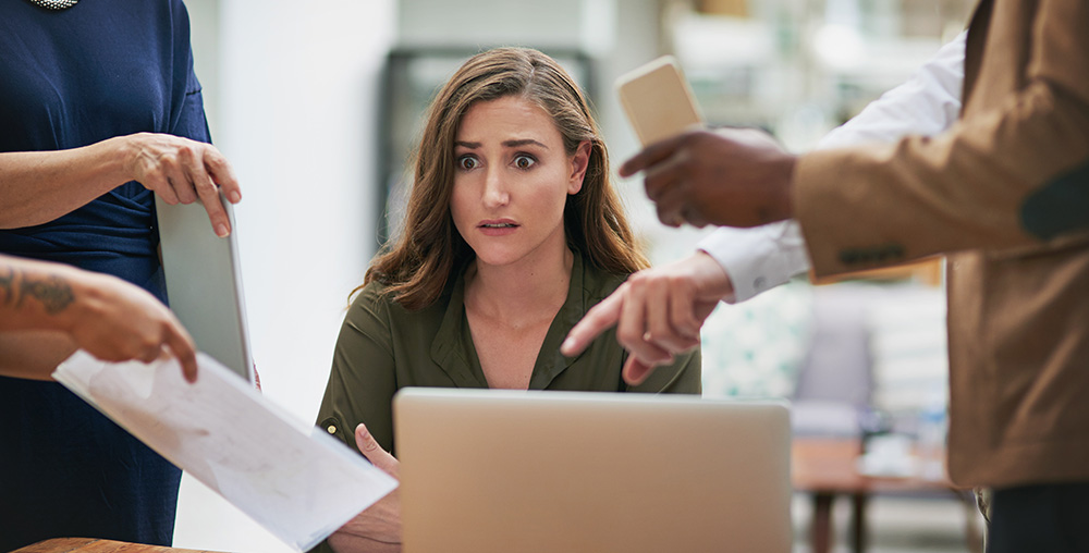 young business woman looking overwhelmed
